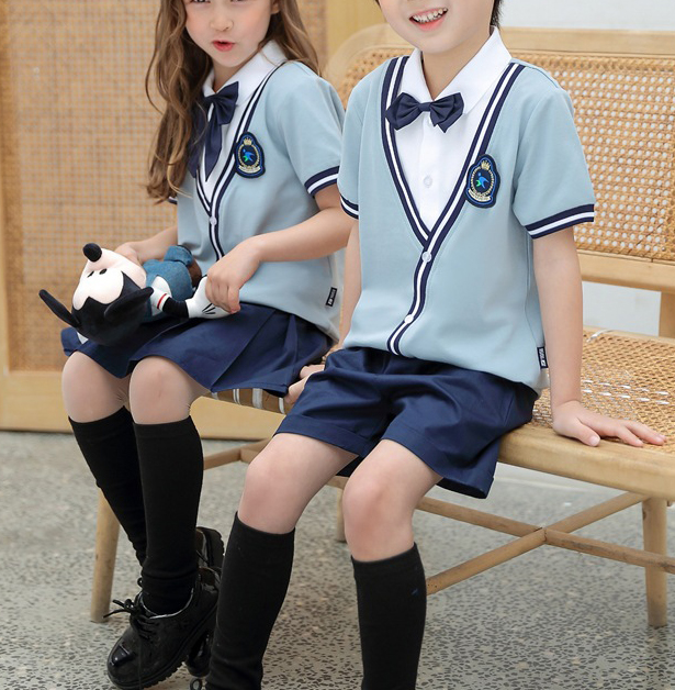 Niños 2 piezas Kindergrand azul claro uniforme escolar camisa de manga corta y falda plisada pantalones cortos